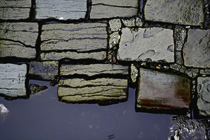 [ photo: Wet Street Cobblestones and a Small Puddle, Hebden Bridge, West Yorkshire, England, Jan 2007 (img 118-089) ]