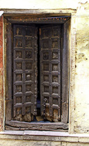 [ photo: Kashi  Streets, near Assi Ghat, Carved Doors, Varanasi, Uttar Pradesh, India, February 2010 (img 194-054) ]