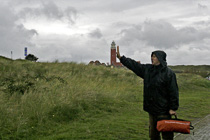 [ photo: Bert Steadies De Cocksdorp LIghthouse Against the Wind, Texel Island, Netherlands, September 2011 (img 232-077) ]